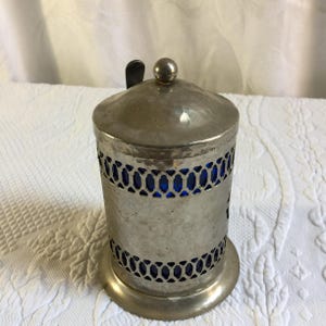 Vintage Coffee Container. Hammered Silver Plate Openwork Design w/ Lid and Spoon. Cobalt Blue Hard Plastic Liner and Spoon Holder. image 3