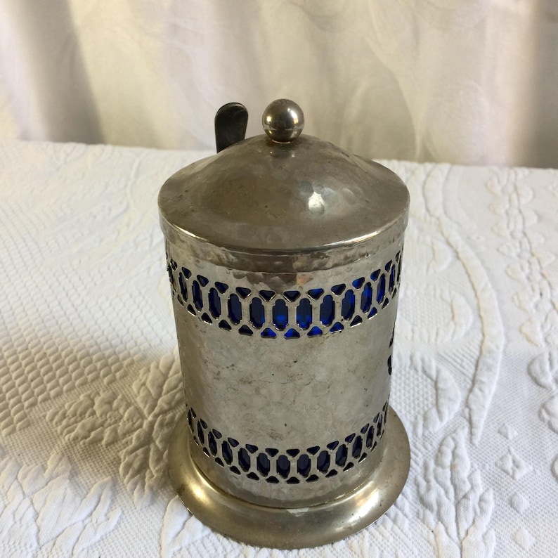 Vintage Coffee Container. Hammered Silver Plate Openwork Design w/ Lid and Spoon. Cobalt Blue Hard Plastic Liner and Spoon Holder. image 3
