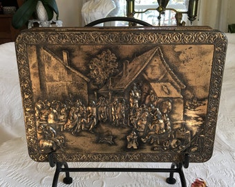 Vintage Teniers Large Gold Tin With 2D Figures in a Gathering in Colonial Days. Decorative Swirling Designs on Sides and Borders.