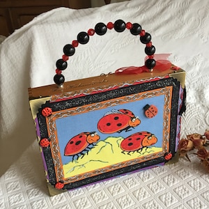 Vintage Cigar Box Purse. Embellished Ladybug Fabric Front With Composite Ladybug Ornaments.