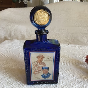 Vintage 1969 50th Anniversary Commemorative Bottle of American Legion, by J. W. Dant. Eagle, Stars and Border on Back.