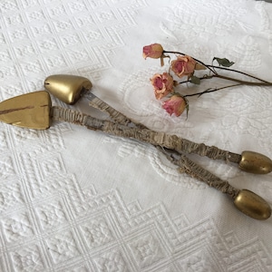 Vintage Shoe Stretcher Pair. Gold Painted Wood on Metal Flat Lengths with Fabric covering.