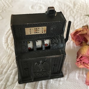 Vintage Cast Iron Pencil Sharpener. Old Slot Machine With Moveable Arm. Golden Eagle Slot Machine Pencil Sharpener. Made in Hong Kong.