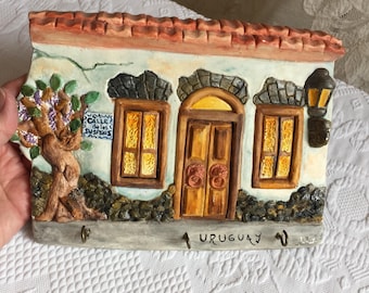 Vintage Plaster House Wall Plaque with Tree, Wall Lantern, Windows and Door with Roof from Uruguay. Three Cup Type Hooks on the Front.
