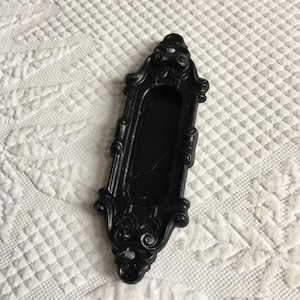 Vintage Black Concave Hardware Ornaments with Scroll Dimensional Elements and Oval Trough Type Display Space in Center. Unique Hardware.