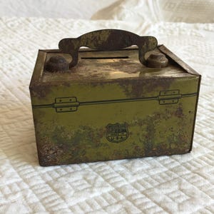 Vintage Cash Box Bank in Army Green and Rust Brown. Charming Little Cast Box but Very Rustic. The Coin Retrieval on the Bottom.