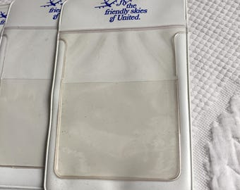 Vintage United Airlines Plastic Protective Pouches. Airline Memorabilia. Image of Airplane with Fly the Friendly Skies of United.