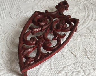 Vintage Cast Iron Red Legged Trivet. Iron Shaped Trivet. Swirling Designs. Great Kitchen Decoration. Use or Display.