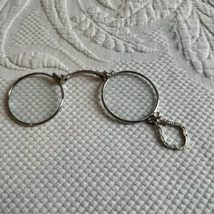Vintage Pince Nez Handheld Glasses, Wire Rim, Lorgnette Folding Spectacles Eyeglasses. Silver Tone w/ Decorative Handle and Closing Clamp.
