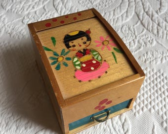 Vintage Roll Top Box for Holding Trinkets or Jewelry or Tiny Collectibles. The Box has Drawer and is Painted w/ a Chinese Girl with Flowers.