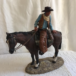 Vintage Large Cowboy Sitting on a Horse Figurine on Rock Look Base. Cowboy w/ Neckscarf, Leather Spatts, Hat and Vest. 3 White Boots Horse.