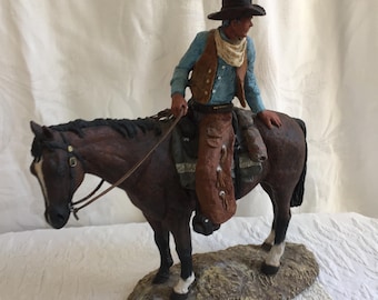 Vintage Large Cowboy Sitting on a Horse Figurine on Rock Look Base. Cowboy w/ Neckscarf, Leather Spatts, Hat and Vest. 3 White Boots Horse.
