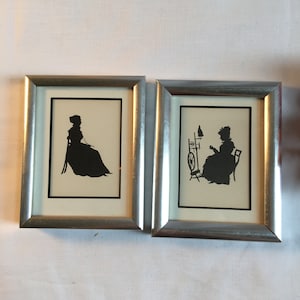 Antique Silhouette Pictures of Sitting Women. Lady Facing Right Holding Pince nez Glasses on Chain. Lady Facing Left w/ Spinning Wheel.