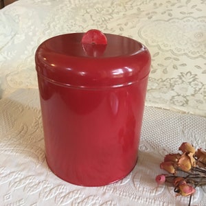 Vintage Red Canister. Metal Kitchen Canister. Could be From the 1950s or 60s. Celluloid Top Half Circle Handle.