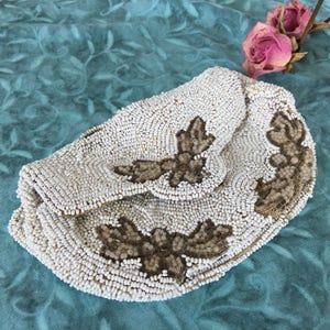 Vintage White Seed Bead Clutch With Brown and Cream Beads Making Flowers and Leaves on the Front. Clutch Handle on the Back. Snap Closure.