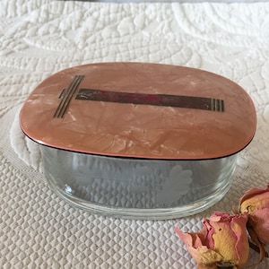 Vintage Art Deco Dresser Jar With Etched Flowers in Glass Jar. Pink Marbleized Celluloid lid With Art Deco Design on Top.