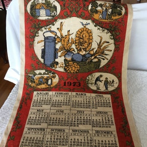 Vintage 1973 Tea Towel. Colonial Scenes, Spring, Summer, Autumn and Winter Around a Harvest Filled Basket. Red Blue and Gold on Dowel Rod.