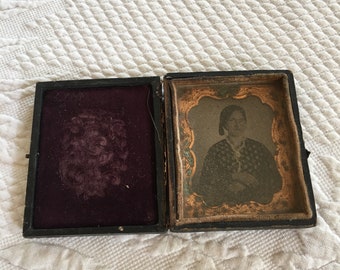 Antique Book Frame with Tintype Picture of Victorian Lady in Flowered Dress Wearing Ring on Little Finger. Tassel From Hair.