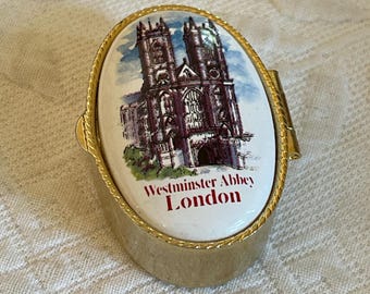 Vintage Brass Pill Box. Ceramic Westminster Abbey London Pill Box. Compression Closure, Plastic Lined Pill Box. Swirling Designs Outside.