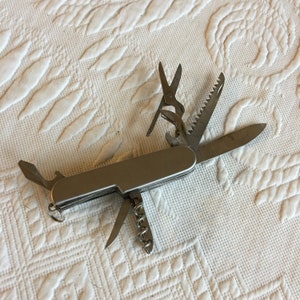 Vintage Swiss Army Knife With At Least 11 Tools. Two Saws, Scissors, Screw Driver, Bottle Opener, Cork Screw, Manicure Tools, Knife.