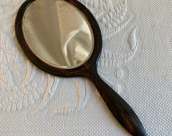 Vintage Faux Tortoise Shell Hand Mirror. Two-Sided Beveled Mirror in Oval Shape. Haziness on Both Sides.