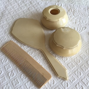 Vintage Dubarry Pyralin Dresser Set of Hand Mirror, Comb, Hair Saver and Powder Box. Ivory Colored Pyralin Celluloid Vanity Set. Well Made.