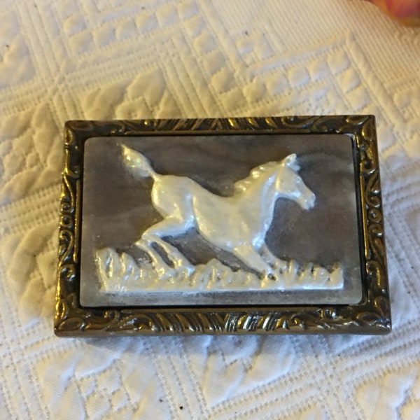 Vintage Horse Belt Buckle. White Glittery Horse on Stone Set in Brass Belt Buckle. Incolay Studios 1976. Molded Swirling Designs in Brass.