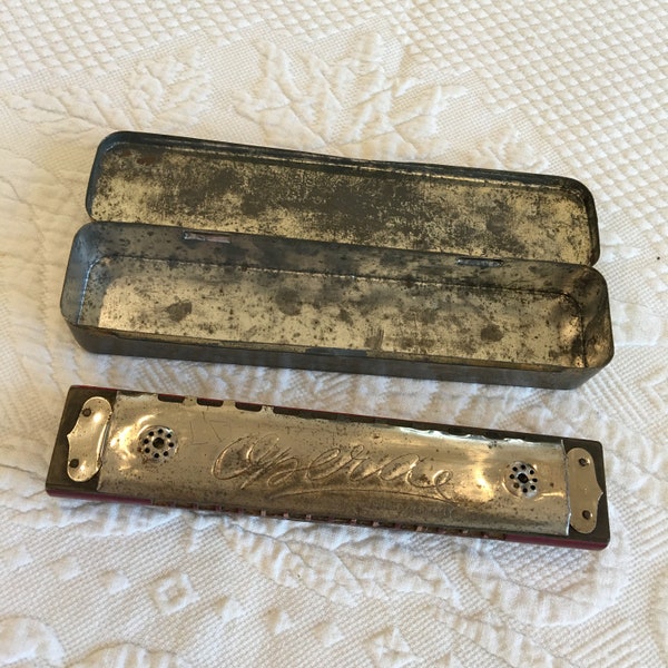 Vintage Opera Harmonica from War Time. Made in Germany U S Zone. Metal Box with Costumed Dancers on stage and Music Hall, Says OPERA.
