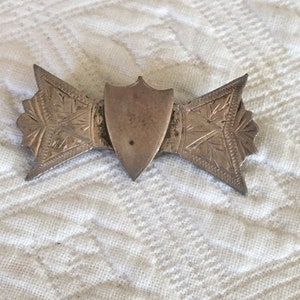 Victorian Sterling Silver Etched and Embossed Bow Shape With Shield in Center. Art Deco Style Sterling Pin Brooch.