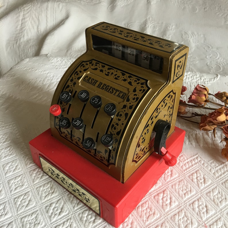 Gold With Black Print and Designs With Red Bottom Vintage Toy Cash Register Black and Red Plastic Handle Push Buttons to Raise Numbers.