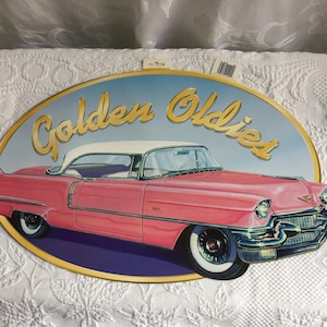 Vintage Amscan Golden Oldies 1950s Pink Cadillac Sign Reproduction Wall Hanging. Artist Bob Kramer. Two-Sided Sign Dangle or Hang.