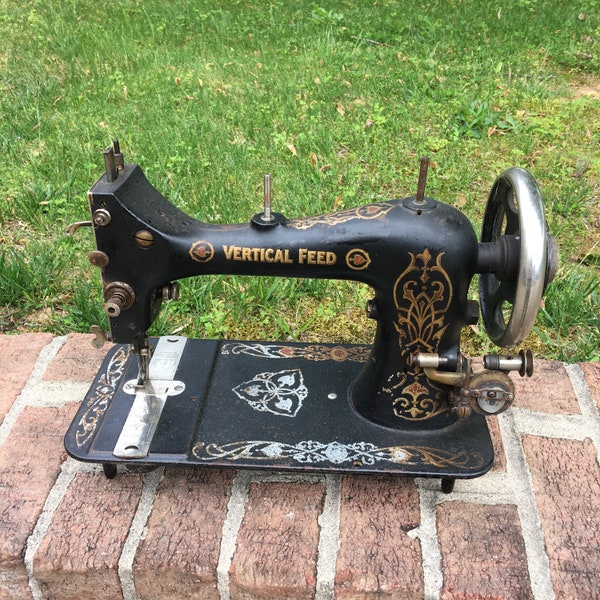 Antique Vertical Feed Sewing Machine. Fancy White, Gold and Red Designs on an Cast Iron Sewing Machine. Great Display Piece.