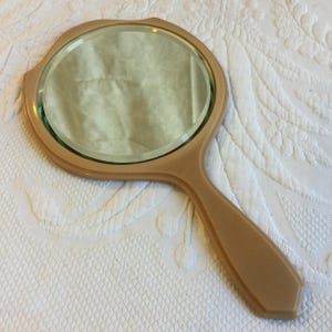 Vintage Celluloid Heavy Beveled Glass Hand Mirror. Sturdy and Well Made in Light Brown Color.