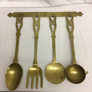Vintage Brass Large Kitchen Utensils with Wall Hanger for Kitchen Display. Openwork Designs on Handles of Spoon, Dipper, Fork and Strainer.