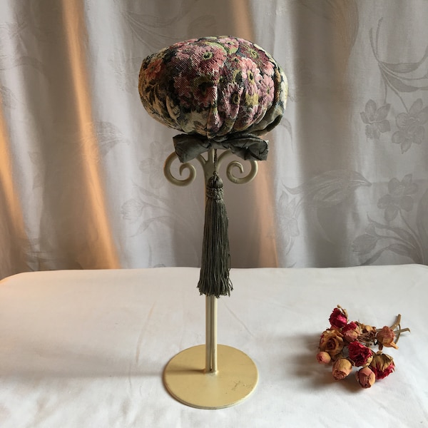 Handmade Tapestry Hat Stand on Wrought Iron Painted Stand. Long Tassel and Silk Bow. Curly Cues Under Floral Tapestry Hat Cushion.
