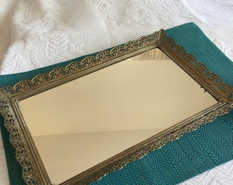 Vintage Gold Mirrored Dresser Tray. Rectangular Shape with Multi Borders and Flower with Swirling Designs Scalloped Stand Up Border.