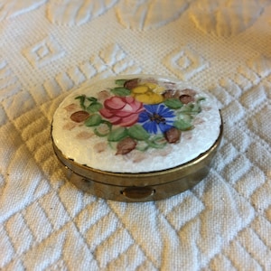 Vintage Brass Cloisonne Pill Box. Push Latch Floral Designed Oval Pill Box. Swirling Circle Design Inside.