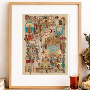 May include: A framed print featuring a colorful illustration of a bustling marketplace with people, buildings, and the text "Kashan" in English and Farsi. The artwork is in a wooden frame and is displayed on a wooden surface.