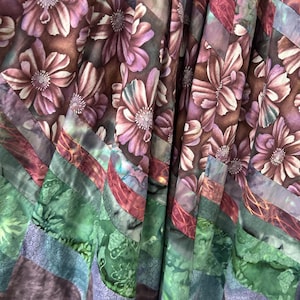 May include: A set of three ceramic mugs with a speckled, matte finish in cream, light grey, and dark grey. Each mug has a simple, minimalist design, suitable for coffee or tea.