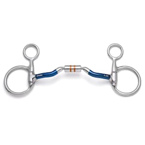 May include: A stainless steel horse bit featuring blue-coated shanks, a central roller with two copper-colored bands, and rings on each side. The metal is engraved with the text ZENUMA and 5.25 inches, indicating the size of the bit.