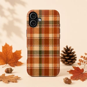 May include: A smartphone case featuring a plaid pattern in shades of burnt orange, cream, and dark forest green. The case has a dual-camera cutout in the upper left corner and covers the back of the device with a consistent grid design.