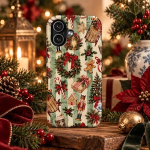 May include: A phone case featuring a festive pattern of Christmas elements including wreaths, nutcrackers, gingerbread cookies, candy canes, wrapped gifts, sleds, and pine branches on a background of alternating cream and sage green vertical stripes.