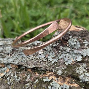 Handmade copper bangle with hammered ends