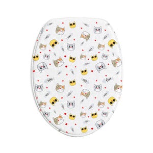 May include: An oval toilet seat cover featuring a white background with a repeating pattern of cartoon cat faces in various colors, including yellow cats with sunglasses, grey cats, and calico cats, interspersed with small red hearts and fish bones.