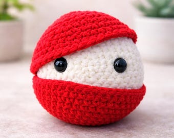 Schema per realizzare una Poké Ball all'uncinetto in formato PDF, tutorial per amigurumi, giocattolo Pokémon per principianti, download immediato, istruzioni passo passo con conteggio dei punti.
