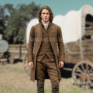 May include: A brown three-piece suit with a long coat, vest, and trousers. The suit is worn with a white cravat and tall boots. The outfit is reminiscent of historical attire, with a classic, tailored design. The background includes a covered wagon.
