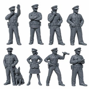 May include: A set of eight gray miniature figurines depicting police officers in various poses and uniforms. The figures include officers with hats, ties, and utility belts, one officer with a dog, and one officer in a skirt, all rendered in a solid gray finish.