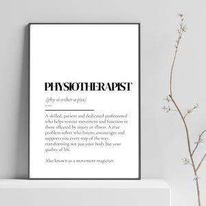 May include: A framed print with the word "PHYSIOTHERAPIST" in bold, black font. The definition of a physiotherapist is below the word. The print is on a white background with a black frame.