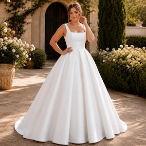 Plus Size Satin Wedding Dress, Square Neck Ballgown, Minimalist Bridal Gown, Elegant Reception Ceremony
Plus Curvy Bridal Gown, Lace Bohemian, Rustic Elegant Long sleeve, Slit A-line Wedding Dress
Plus Size Sparkly Boho Wedding Dress, Lace Bridal Gown with Open Back | Romantic Beach & Outdoor Wedding Dress