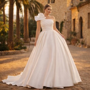 Plus Size Satin A-line Wedding Dress, One Shoulder Floral Bridal Gown, Elegant Minimalist
Plus Size Sparkly Boho Wedding Dress – Off Shoulder Lace Bridal Gown with Open Back | Romantic Beach & Outdoor Wedding Dress